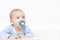 Baby Sucking Pacifier, Infant Kid Boy Raising Up Head with Dummy