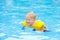 Baby in swimming pool. Kids swim.