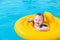 Baby swims in a circle on the sea. Selective focus.