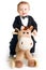 Baby in tailcoat on rocking horse