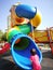 Baby toddler girl try to climb up the slide.