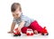 Baby toddler playing with toy car