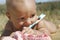 Baby with toothbrush