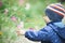 Baby touches the flower