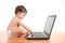 Baby typing on a laptop computer keyboard