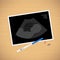 Baby ultrasound picture, pregnancy test on table