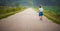 Baby walk on country rural road in fields