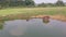 Baby water buffalos lie in the lake to protect themselves from annoying insects and to cool off from the midday heat. a view from