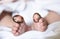 Baby wearing wedding rings on big toes