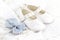 Baby white baptism or birthday dress and shoes close up with spa