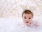 Baby in white rabbit costume