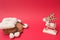 Baby winter boots and wood deer on red background, copy space. warm cloth for child