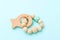 Baby wooden teether on blue background
