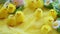 Baby yellow easter toys chicks and eggs on a background of feathers. Festive video greeting card.