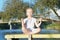 Baby yoga Lotus pose.. a child practicing yoga outdoors