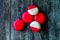 Babybel Cheese in Red Wex on Wooden Surface Ready to Eat