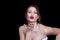 Babyface female model wearing strapless white dress on black background