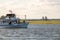 Babylon, New York - June 14, 2019 : A public fishing boat sailing past the Robert Moses Causeway