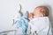 Babysleeps on bed. Infant development concept, toddler restful sleep, teething, colic....