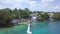 BACALAR, MEXICO, 06 OCTOBER 2017: shot from drone getting away from shore featuring coastal like with hotels, yacht, wooden pier a