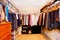 Bachelor closet interior with lots of business clothes.