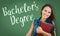 Bachelors Degree Written On Chalk Board Behind Mixed Race Teen