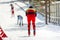 back athlete skier down mountain skiing at stadium