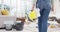 Back, cleaning and a woman in a messy living room for housekeeping or chores in the home closeup. Product, bacteria and