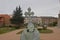 Back And Cross Of An Angel In The Gardens Of The Episcopal Palace Of Gaudi In Astorga. Architecture, History, Camino De Santiago,