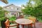 Back deck of guest house with wooden table set