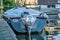 The back end of a small recreational boat moored on a quiet lake