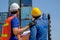 The back of engineer and technician help together for checking the quality of product and system in cargo containers area