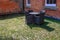 Back garden, court yard view with table and chairs in dark grey wicker