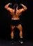 Back of handsome muscular bodybuilder