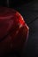 Back headlight of a modern luxury red car, auto detail, car care concept in the garage