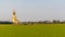 The back of a large golden yellow buddha At Wat Muang, which is an important religious tourist destination In Ang Thong Province