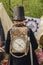 The back of a little boy in steampunk clothing