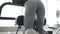 Back look of girl working out with simulator for leg and buttocks` muscles 4K