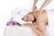 Back massage at day spa by masseuse