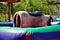 Back of a mechanical bull in the yard in the sun