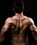 Back muscles of big healthy naked man