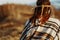 Back of native indian american woman walking in mountains in eve