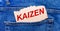 In the back pocket of the jeans there is a brown piece of paper with the text KAIZEN