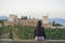 Back portrait of young beautiful and relaxed woman having Summer holidays in Spain enjoying cheerful beautiful view at Alhambra of