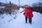 Back profile of two girls in snow