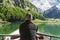 back of rower in front beautiful Seealpsee lake and Alpstein mountain in Appenzell, Switzerland