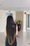 Back side or rare view of black and coloured dry long hair women