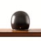 Back side view of black color vintage style motorcycle helmet on natural wooden desk.Concept classic object isolated