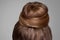 Back side view closeup portrait with creative elegant brown collected hairstyle, bun hair