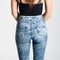 Back side of woman wearing high-waisted jeans